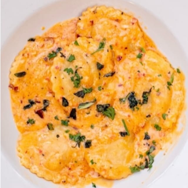 Butternut Squash Ravioli in Roasted Red Bell Pepper Sauce.
