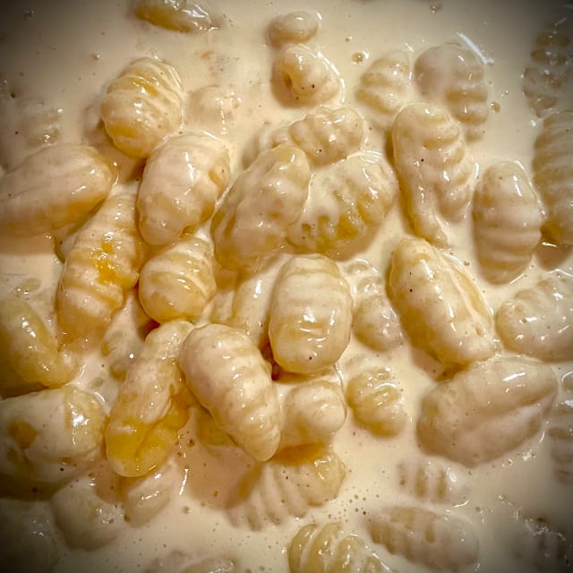 Side of Gnocchi with Sauce.